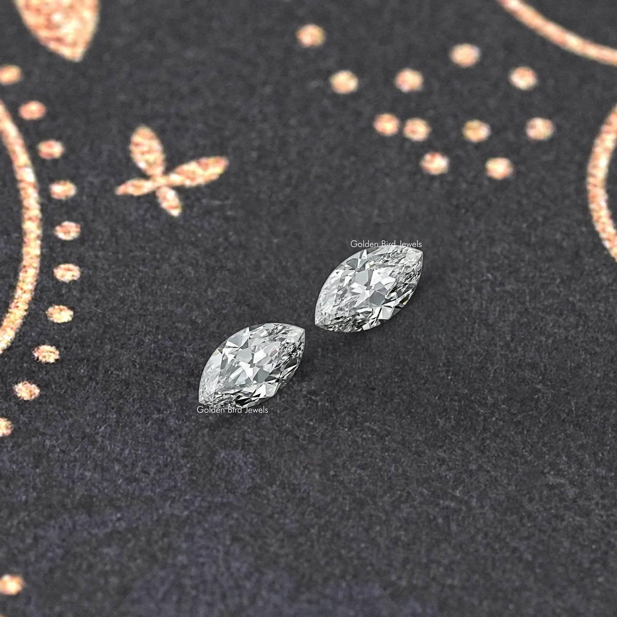 Two marquise-cut lab-grown diamonds with crisp, reflective faceted surfaces
