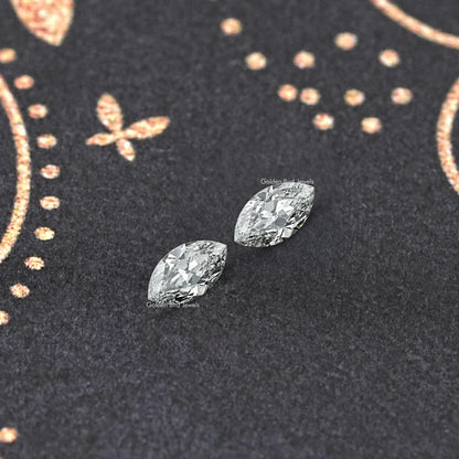 Two marquise-cut lab-grown diamonds with crisp, reflective faceted surfaces