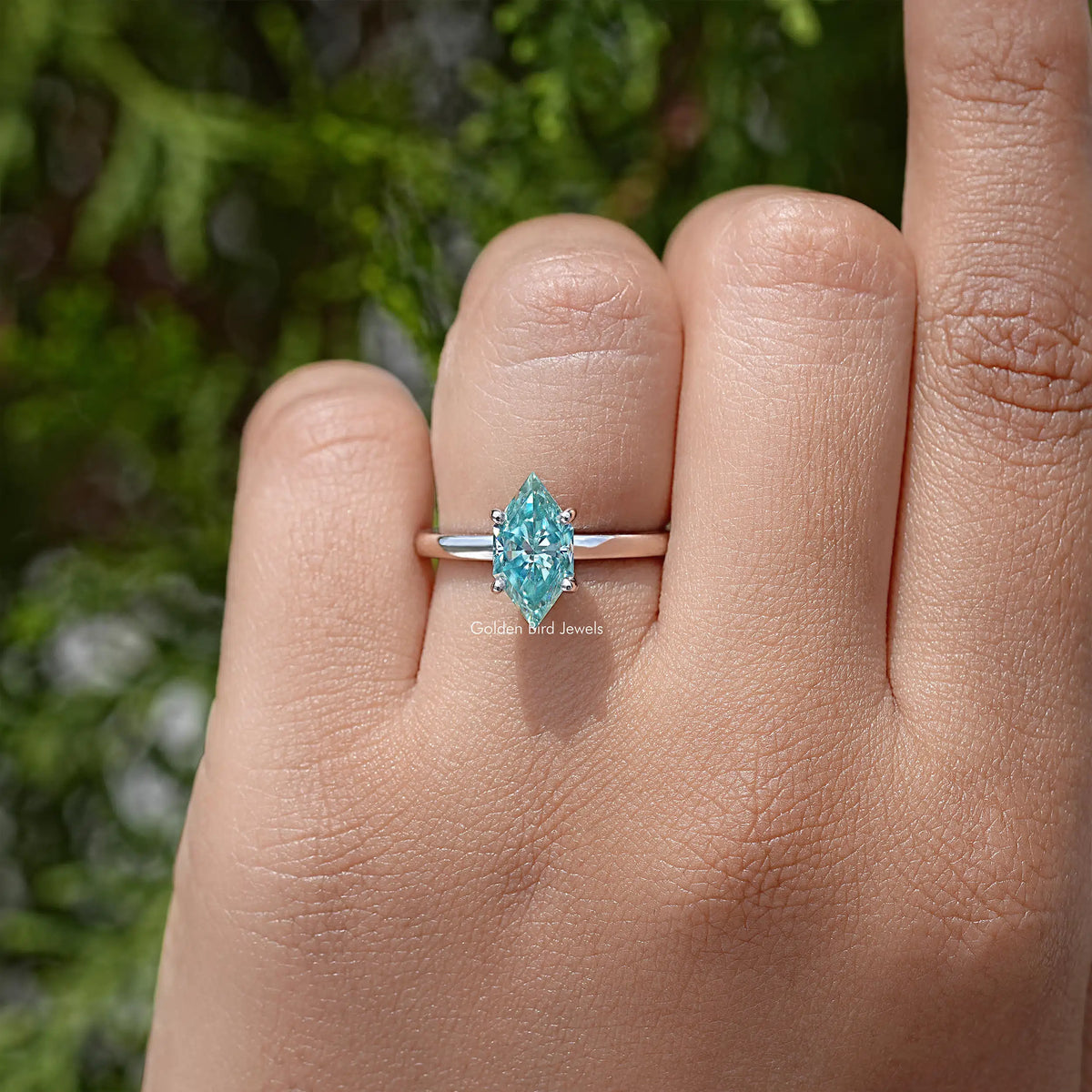 Sterling silver marquise-cut moissanite solitaire ring with hidden halo, light blue