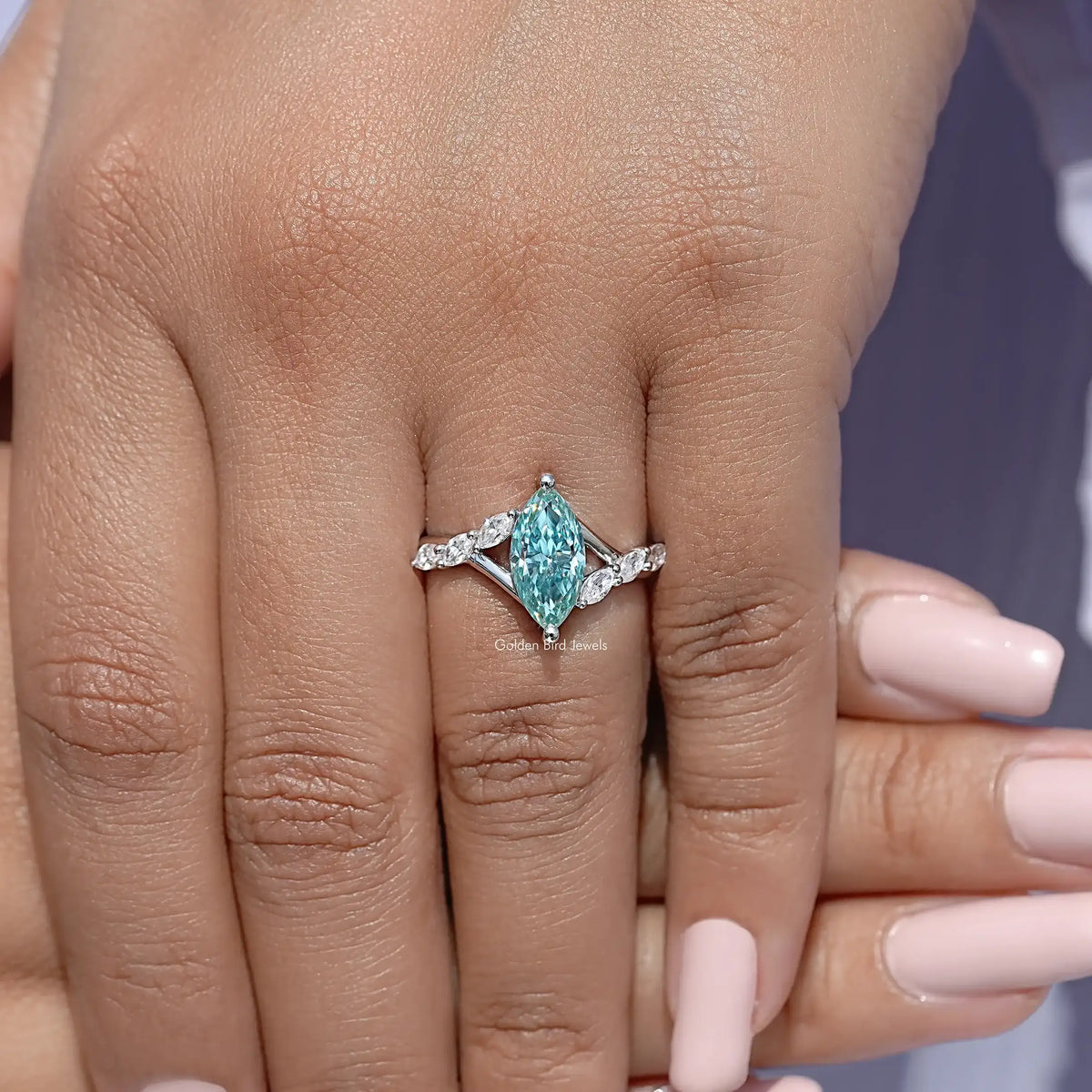 Teal marquise gemstone floral wedding ring on hand, sterling silver with side stones
