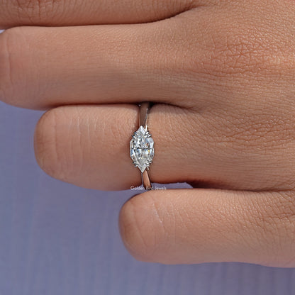 Marquise solitaire ring with moissanite center stone and slim silver band, close-up