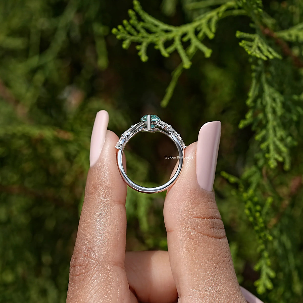 Sterling silver floral wedding ring with marquise gemstone, seen from back angle