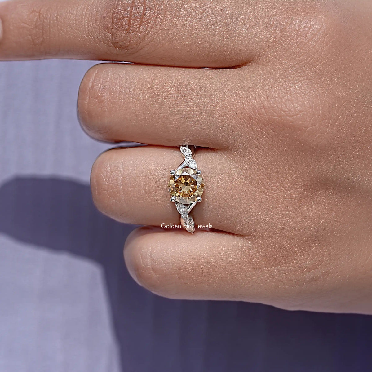 Round yellow moissanite ring with small side stones, sterling silver band