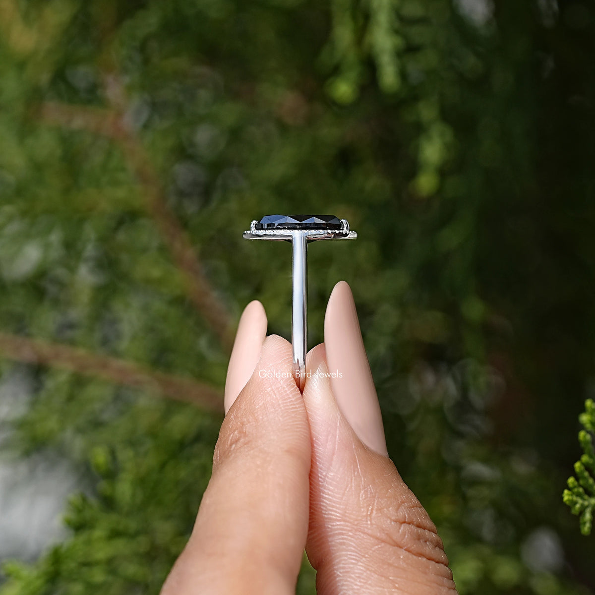Marquise halo ring top view on finger, sterling silver band
