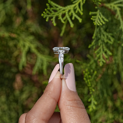 Sterling silver ring with marquise-cut center stone and arched side prongs