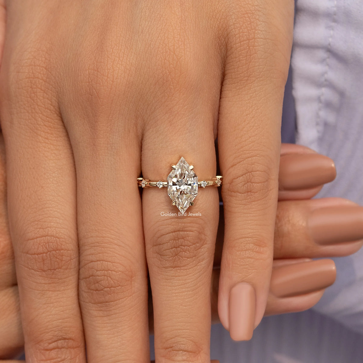 Gold-tone marquise moissanite ring with center marquise stone and two side stones