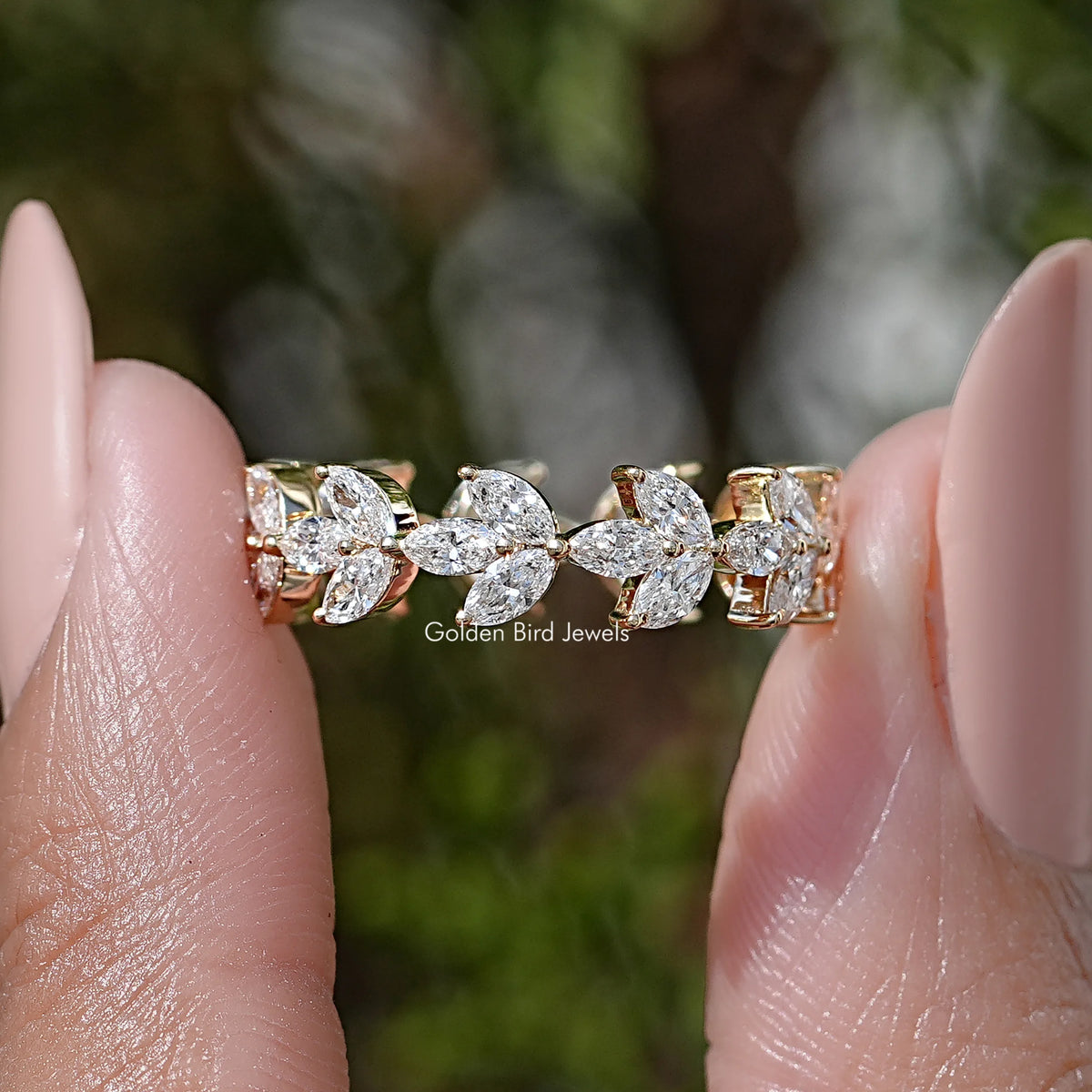 Lab diamond wedding band with marquise stones, gold-tone links; close-up