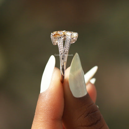Marquise-cut butterfly engagement ring, prong-set stones on tapered silver-tone band