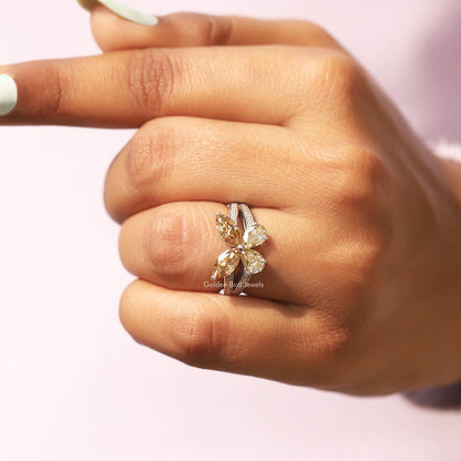 Marquise-cut butterfly engagement ring with sparkling center stone and openwork shank