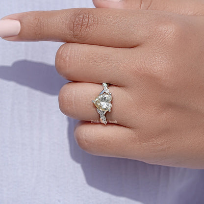 Sterling silver ring with heart-shaped center stone and prong-set side stones