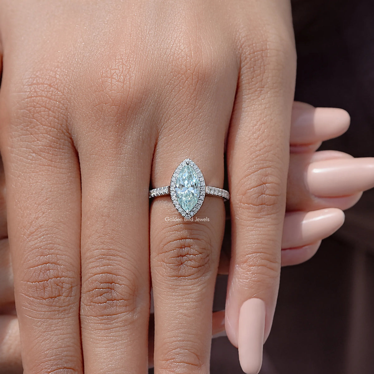 925 sterling silver halo marquise-cut blue accent bridal ring on hand