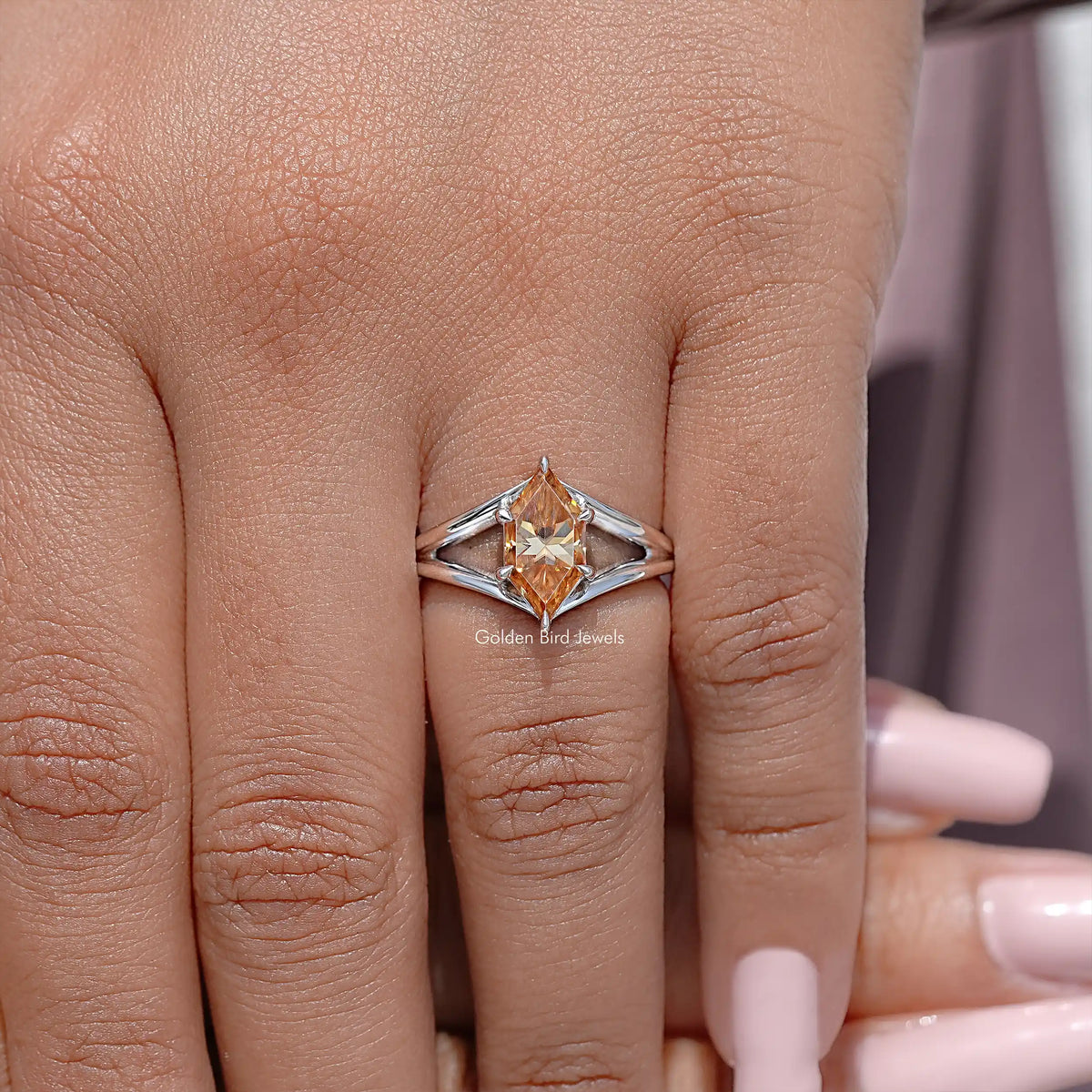 925 sterling silver marquise-cut moissanite ring with split-shank band, worn on hand