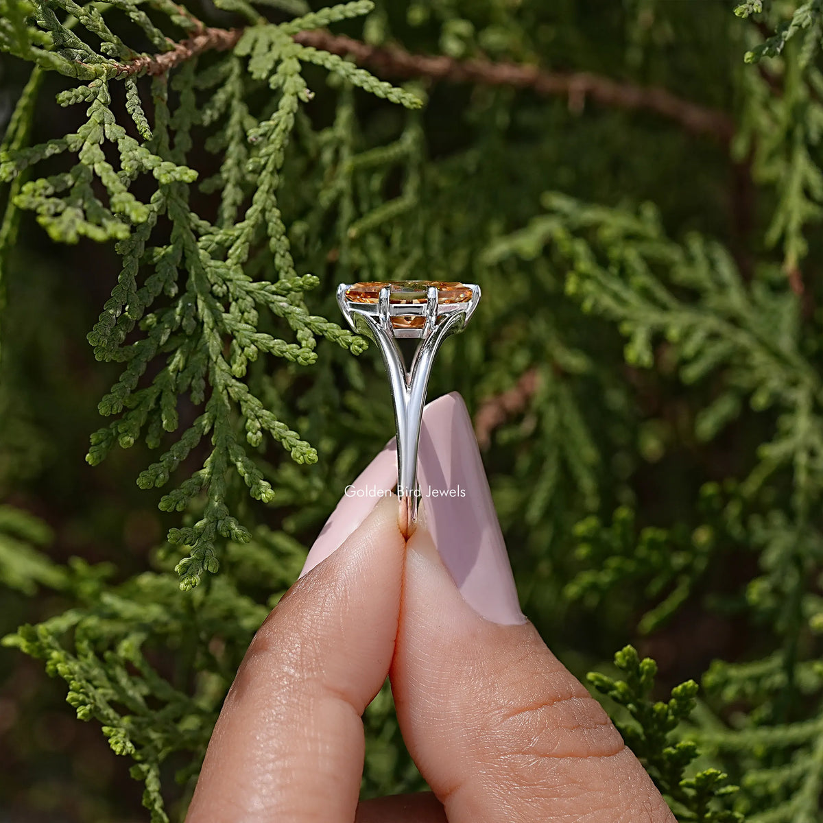 925 sterling silver ring with orange marquise-cut moissanite in split-prong setting