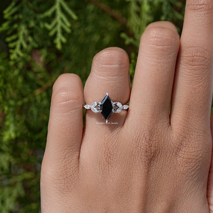 Silver marquise black center ring with three leaf-like clear stones on band