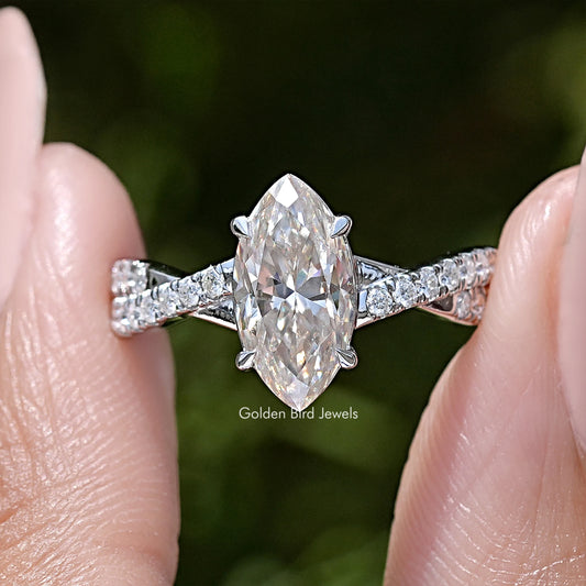 Marquise moissanite twisted accent wedding ring with baguette side stones