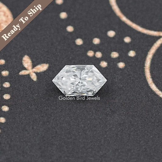 Marquise-cut moissanite loose stone, elongated clear gemstone with star-like facets.