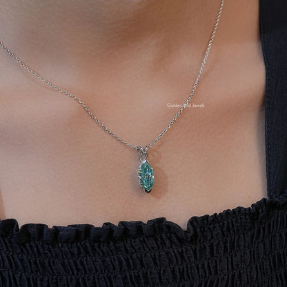 Green gemstone marquise-cut solitaire pendant on silver chain necklace, neckline view