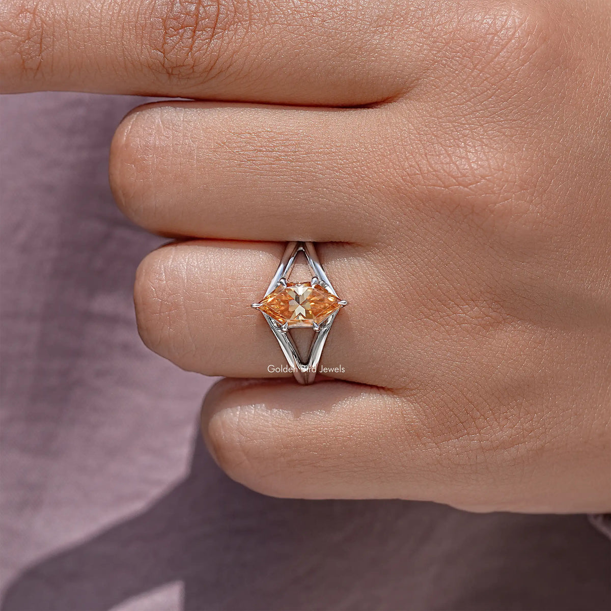 925 sterling silver ring with orange marquise-cut center stone and split-shank prongs