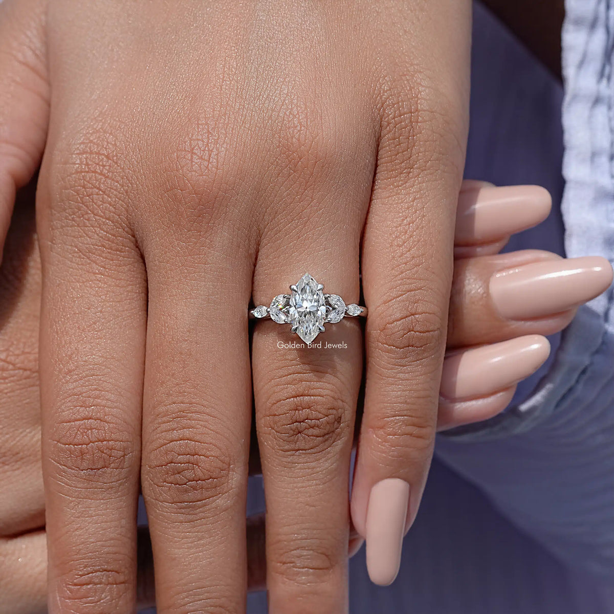 Marquise-cut moissanite diamond leaves ring close-up, prong-set marquise center stone