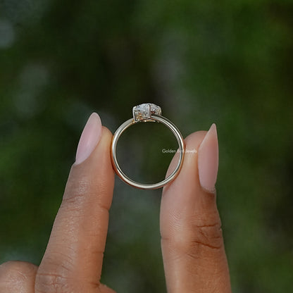 Marquise moissanite solitaire ring viewed from the front, prong-set center stone