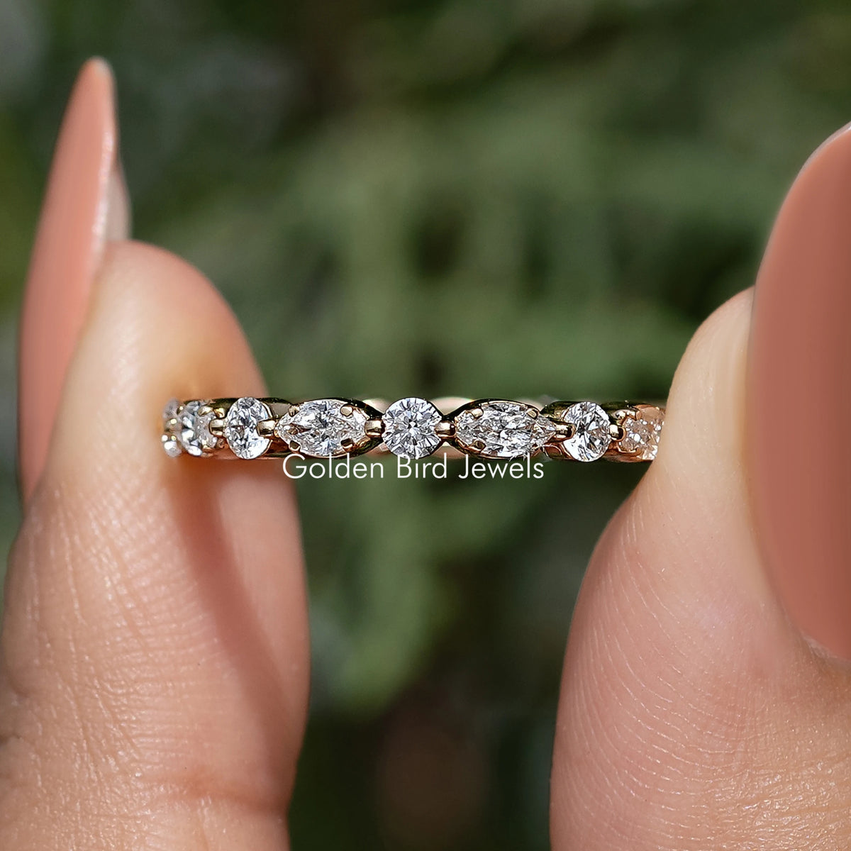 Lab-grown diamond wedding band with marquise and round stones, side profile