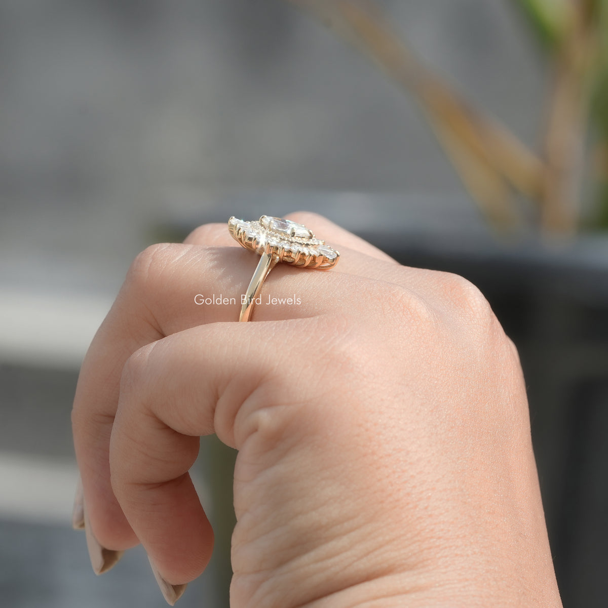 Side View of Marquise Cut Halo Ballerina Ring In finger