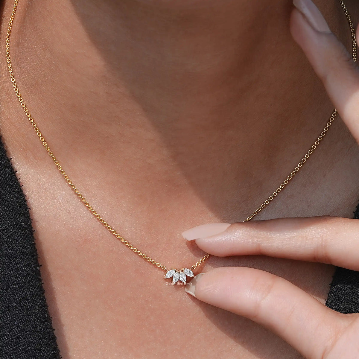 Two Finger's Holding of Marquise Cut Diamond Minimalist Pendant In Yellow Gold