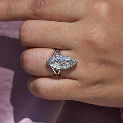 Marquise lab-grown diamond ring with split shank, silver-tone prongs on finger