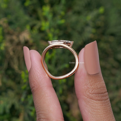Rose-gold curved solitaire ring with marquise-cut lab diamond, top view