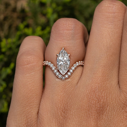 Gold-tone marquise-cut diamond ring with curved halo-like side stones