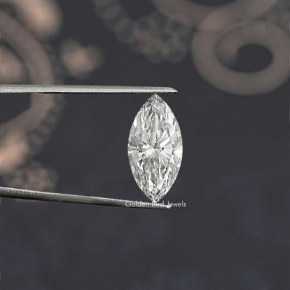 Marquise-cut lab-grown diamond held between metal tweezers, bright oval form