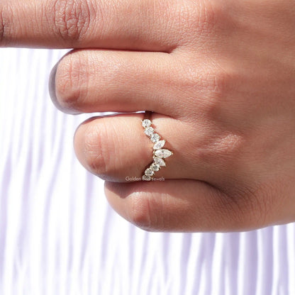 Curved stacking ring with marquise-cut moissanite stones, set in a gold band