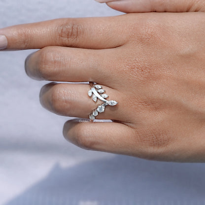 Moissanite V-shaped wedding band with marquise-cut stones on curved setting