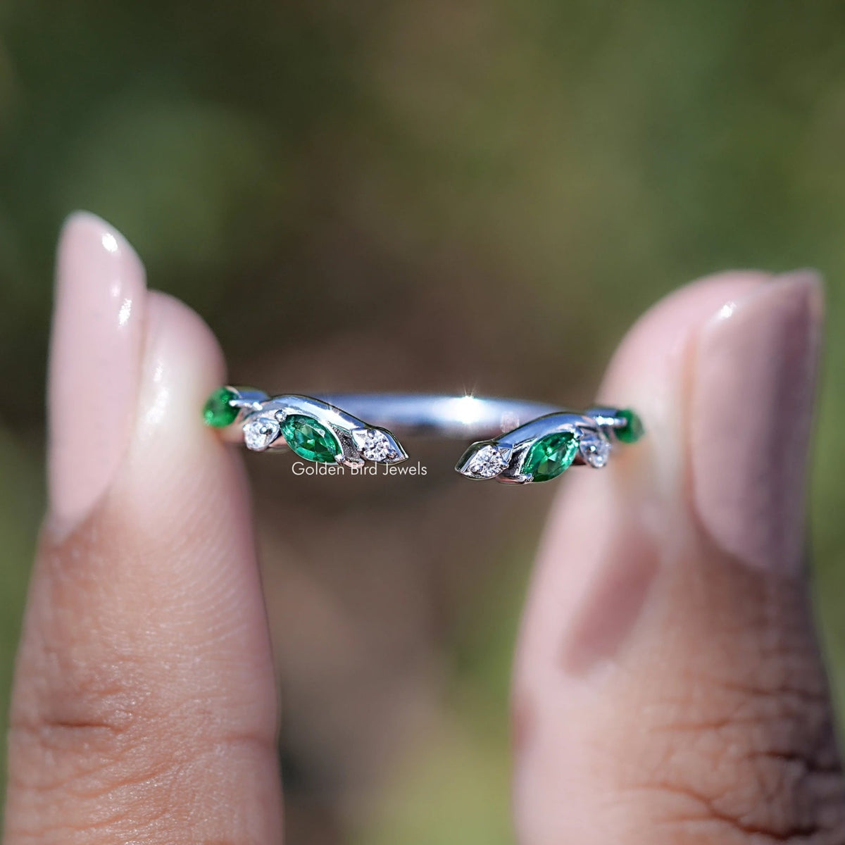 Marquise emerald gemstone open cuff wedding band with small colorless moissanite accents