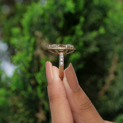 Marquise-cut halo engagement ring with pavé accent stones, side profile