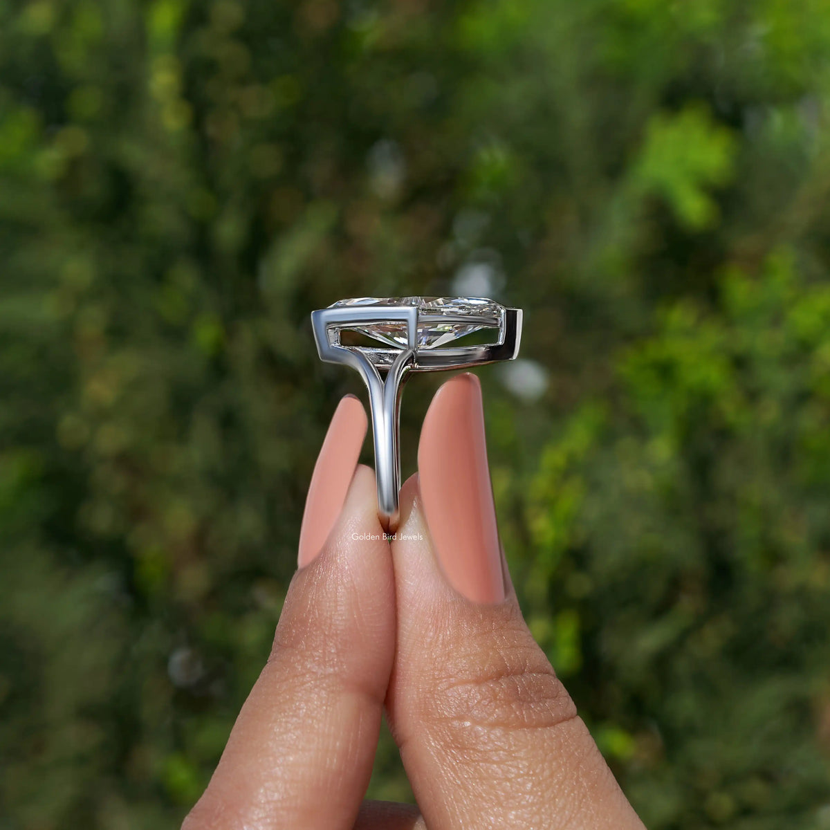 Marquise diamond ring top view showing prong-set marquise stone and split band
