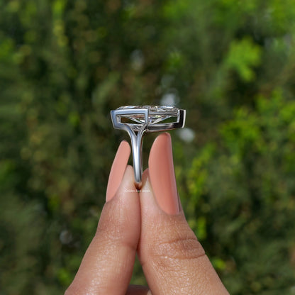 Marquise diamond ring top view showing prong-set marquise stone and split band