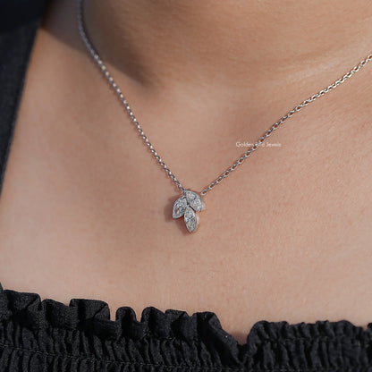 Three-stone marquise-cut diamond pendant with silver chain, flower-shaped setting