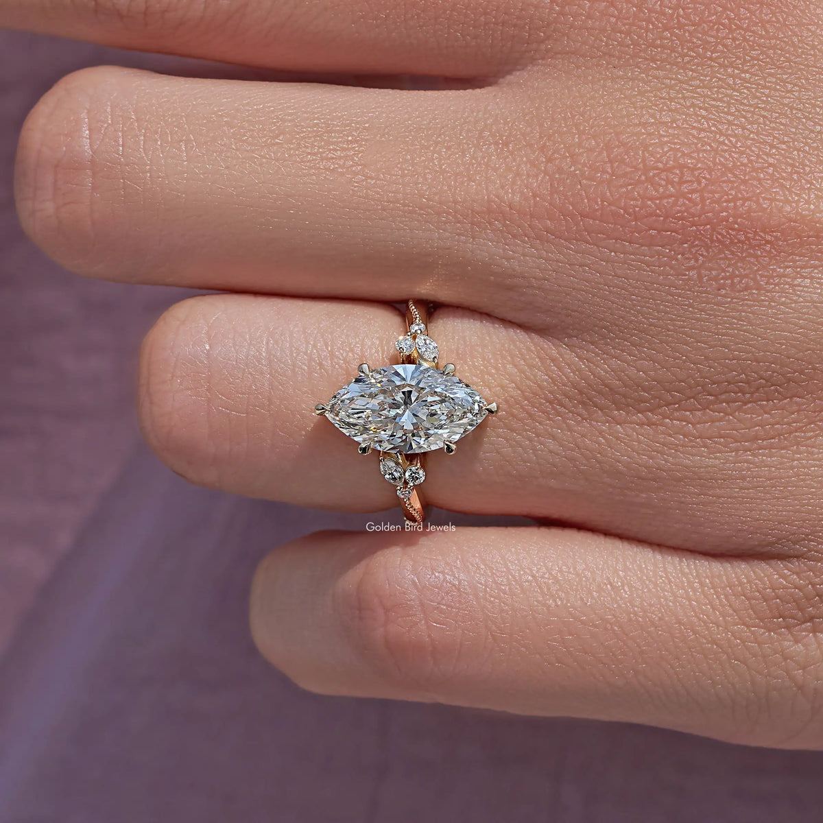 Marquise-cut lab-grown accent ring with clustered halo and prong set