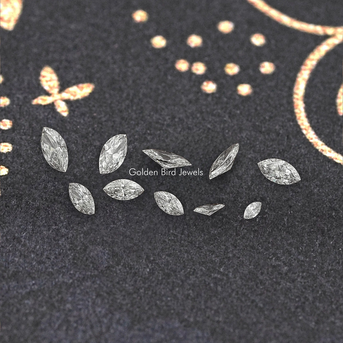 Marquise-cut lab-grown diamonds, scattered loose marquise stones on dark display