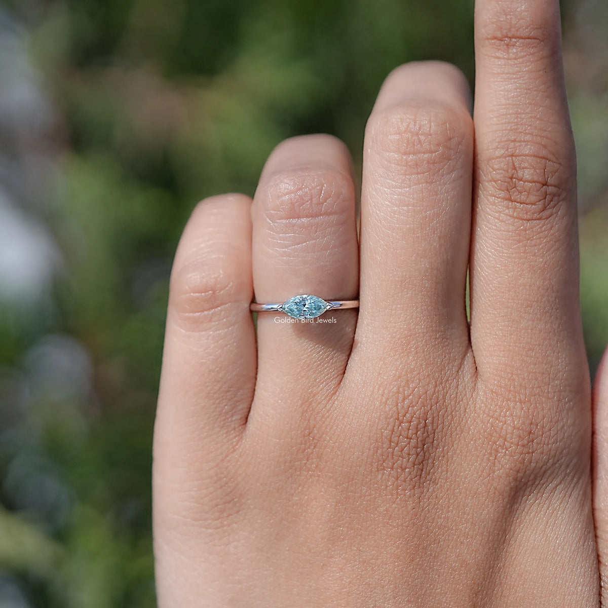 In finger view of Marquise Cut Moissanite Solitaire Ring