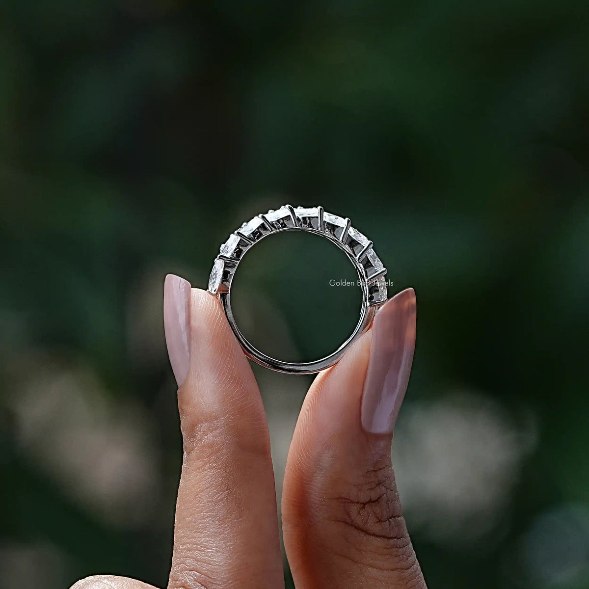 Silver-tone marquise-cut moissanite stackable wedding band, top view on hand