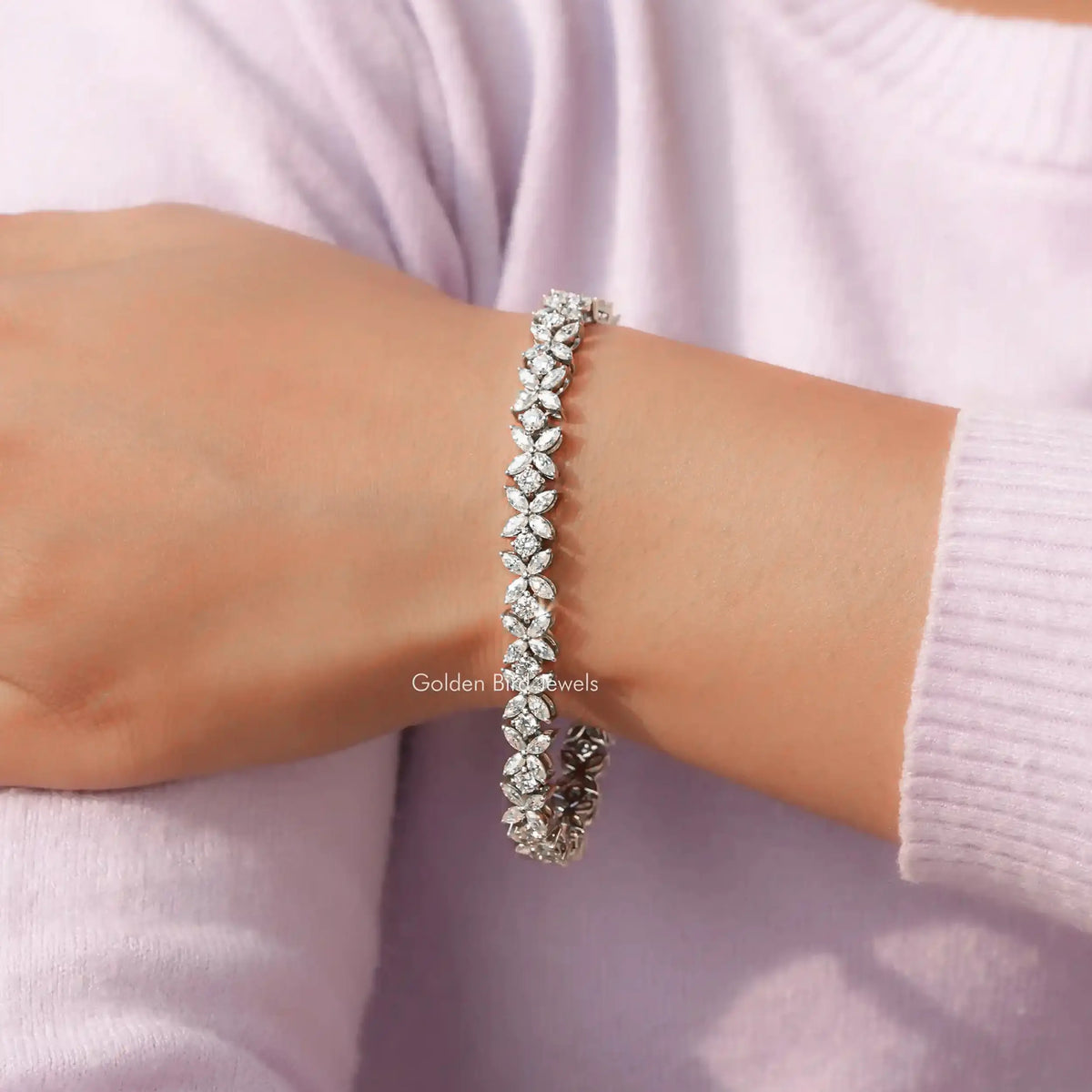 View of Round Cut Lab Diamond Marquise Bracelet In Women's Hand 