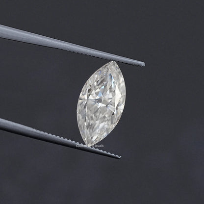 Marquise-cut moissanite loose stone held in tweezers, clear white marquise shape