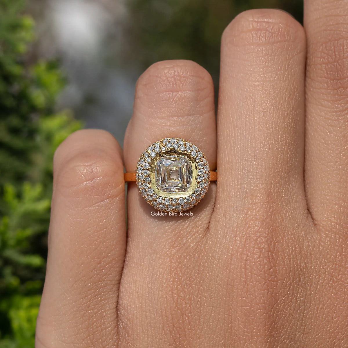 Yellow-gold moissanite halo engagement ring with square center stone and sparkling border