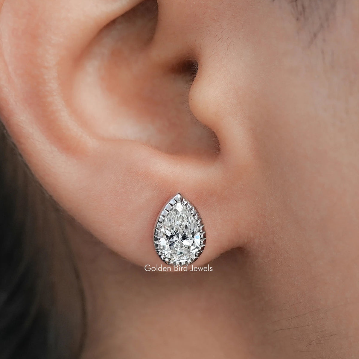 In Ear view of Milgrain Pear Cut Lab Diamond Stud Earrings