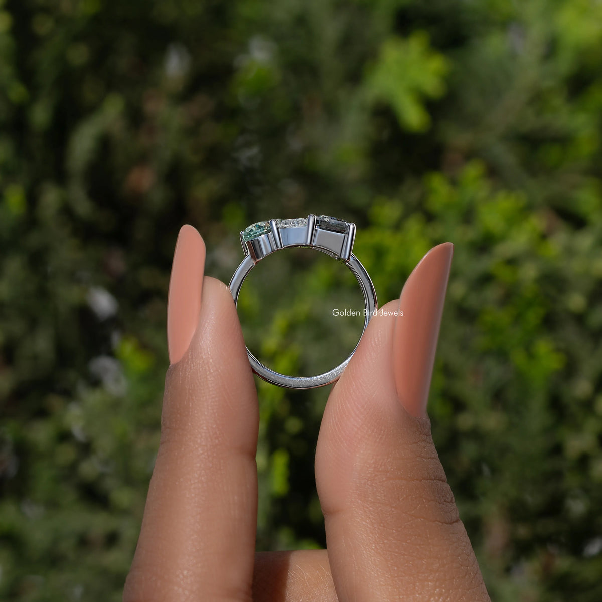 Three-stone moissanite engagement ring in silver with three prong-set center stones