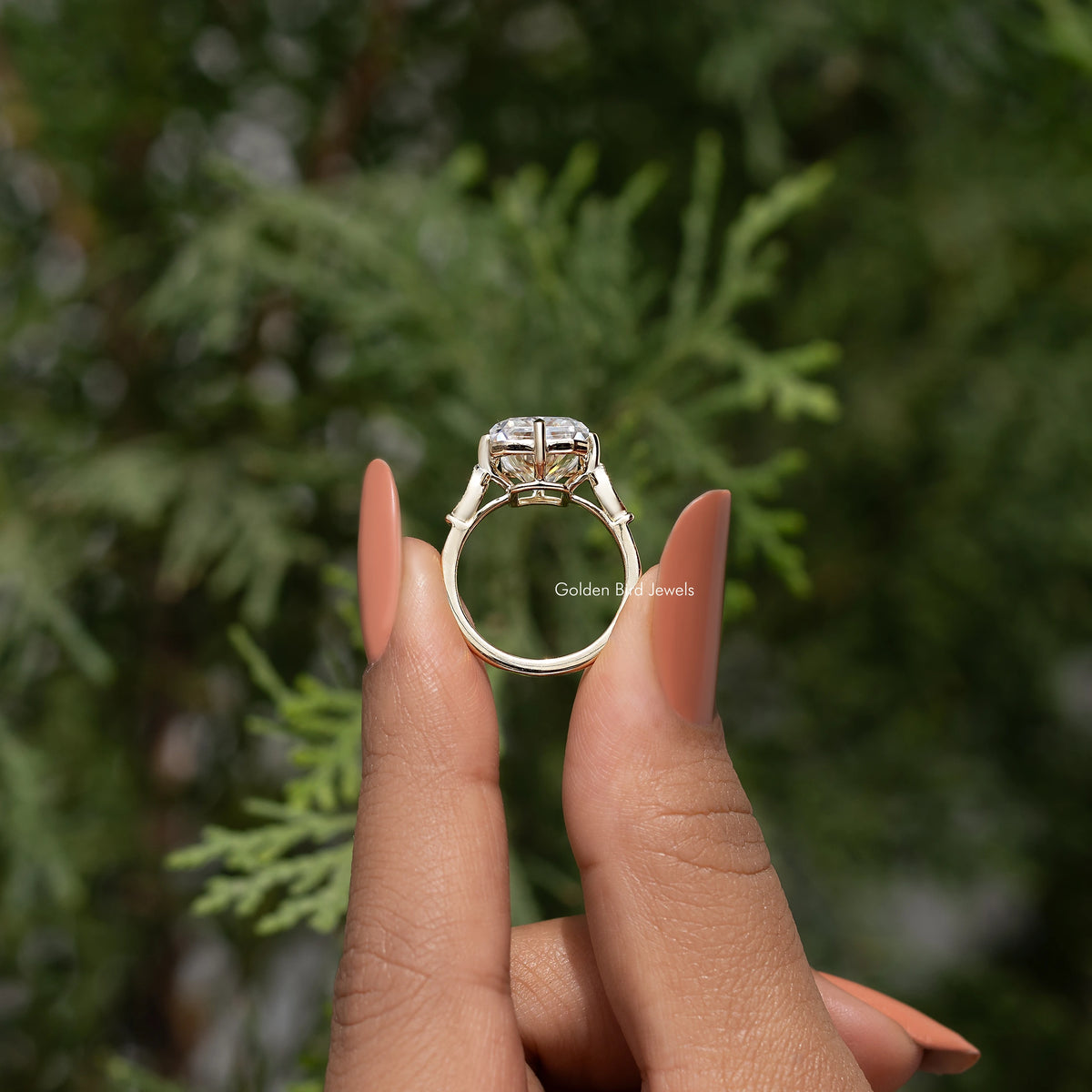 Engagement ring with rectangular center stone, prong setting, slim band