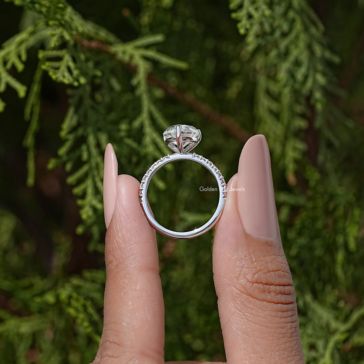 Heart-shaped moissanite solitaire ring, open-back view of silver band