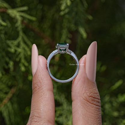 Moissanite ring with asscher-cut center stone, side view